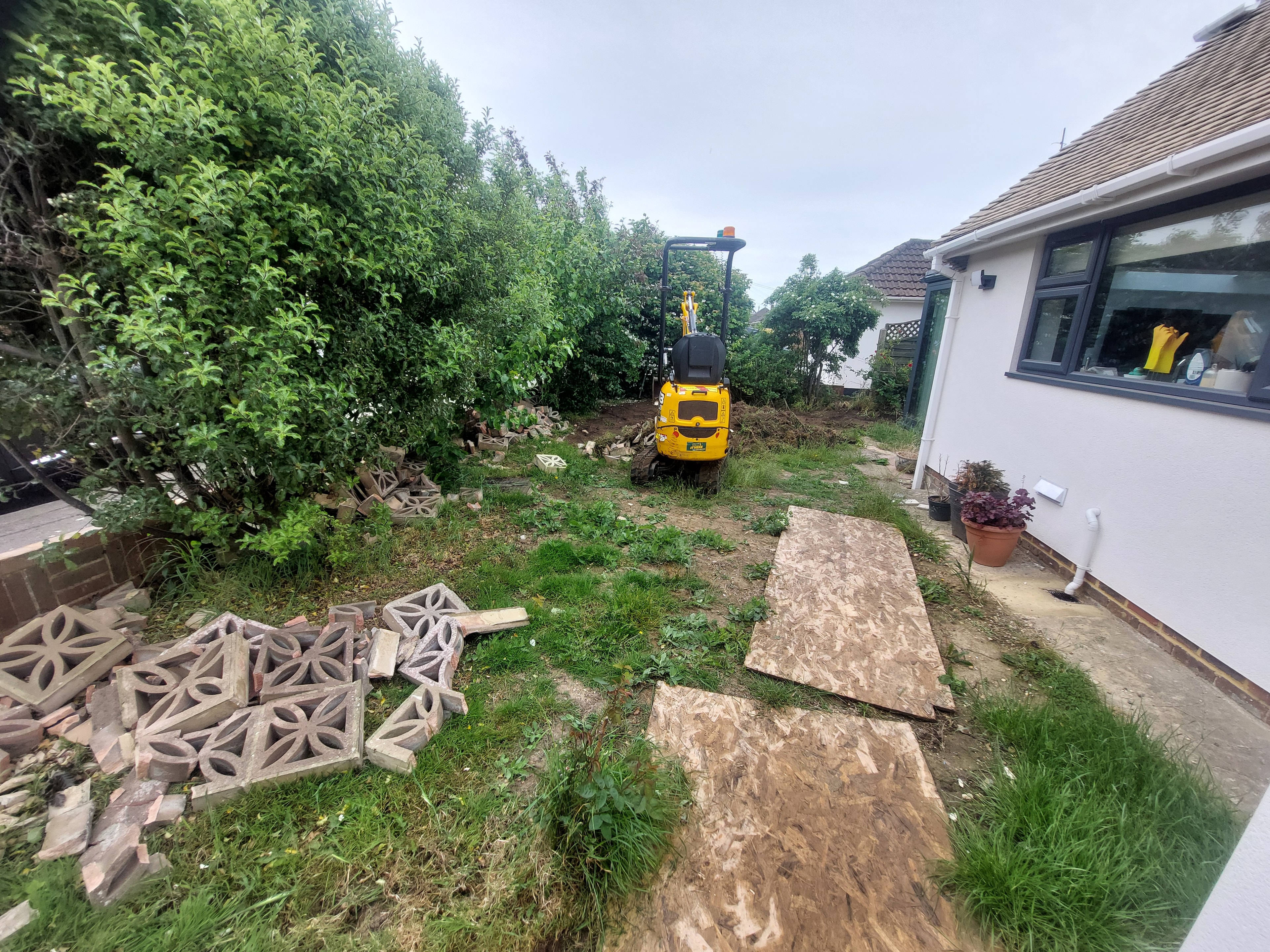 Before — Hit and miss fencing panels with metal posts